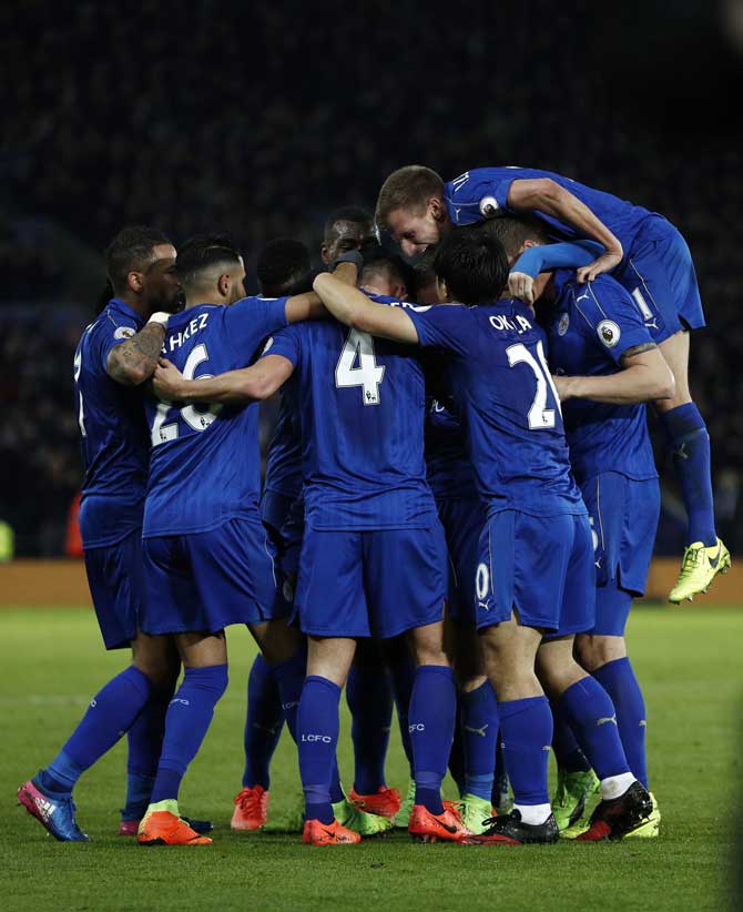 Leicester City's English midfielder Danny Drinkwater celebrates with teammates. Pic  PTI