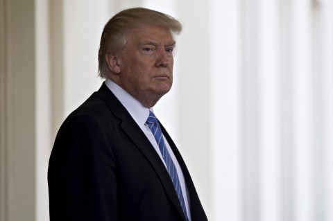 President Trump stands outside the West Wing of the White House on Wednesday