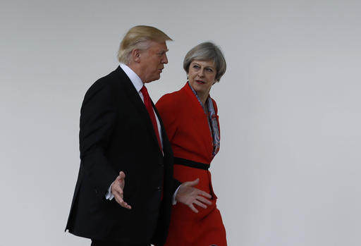 27 2017 US President Donald Trump and Britain's Prime Minister Theresa May walk along the colonnades of the White House in Washington. British lawmakers are set to hold a debate on Monday in London to