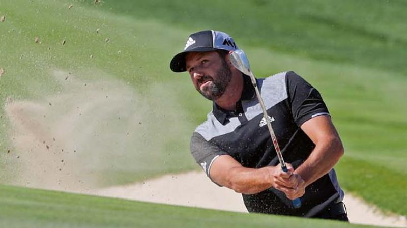 Spain’s Sergio Garcia comes out of a bunker during the third round of the Dubai Desert Classic at the Emirates Golf Club on Saturday