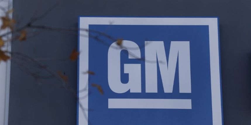 Currency losses hit GM's fourth-quarter profits