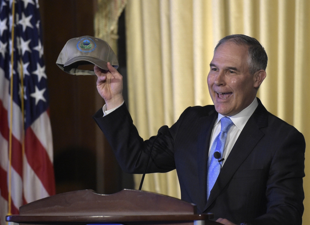 Newly appointed Environmental Protection Agency Administrator Scott Pruitt holds up a hat presented to him before speaking to EPA employees in Washington Tuesday Feb. 21 2017