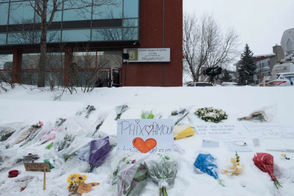 Messages are placed near the Quebec City mosque that was the location of a shooting spree on February 1. A Montreal funeral service will be held today for three of the six men who were fatally shot in the mosque