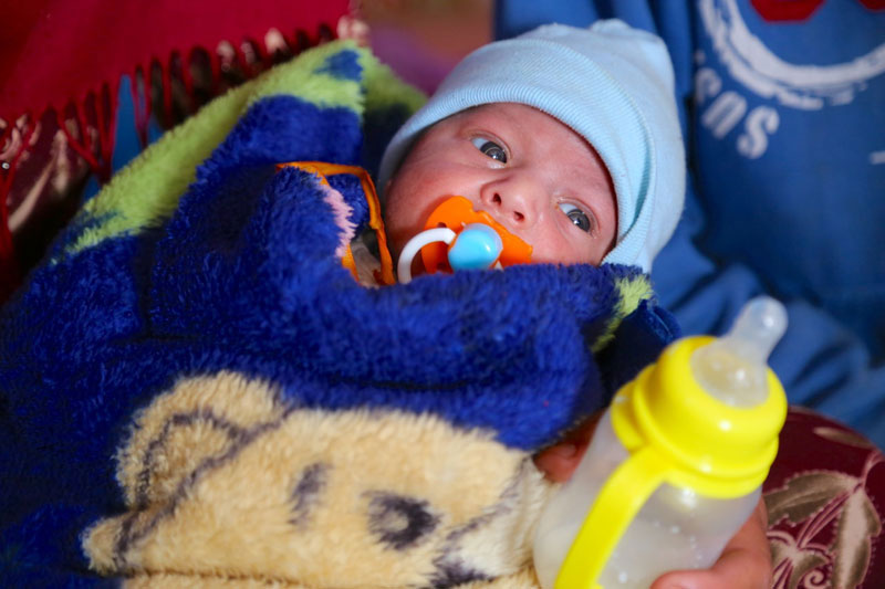 A baby displaced by the conflict in Mosul shelter at the Qayara emergency site in Ninewa governorate Iraq