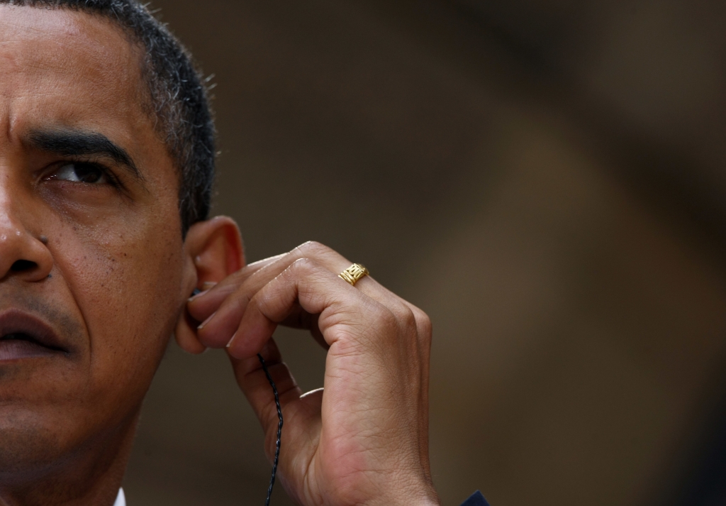 DRESDEN GERMANY- JUNE 05 U.S. President Barack Obama sets his ear phone during a news conference