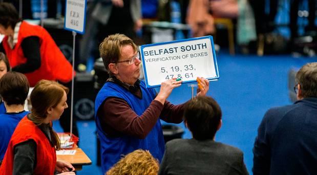 Election count staff count ballot papers at the main Belfast count centre Titanic Exhibition Centre