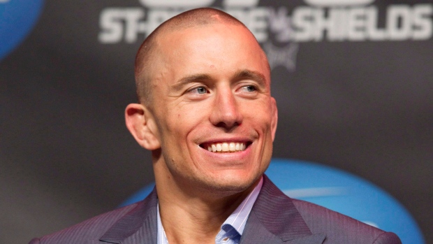 Georges St-Pierre above will fight Michael Bisping for the UFC Middleweight championship after a 3 1/2-year absence