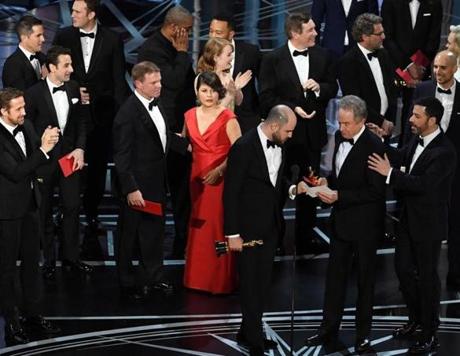 HOLLYWOOD CA- FEBRUARY 26 'La La Land&apos producer Jordan Horowitz holds up the winner card reading actual Best