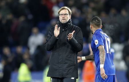 Liverpool manager Juergen Klopp applauds fans after the game