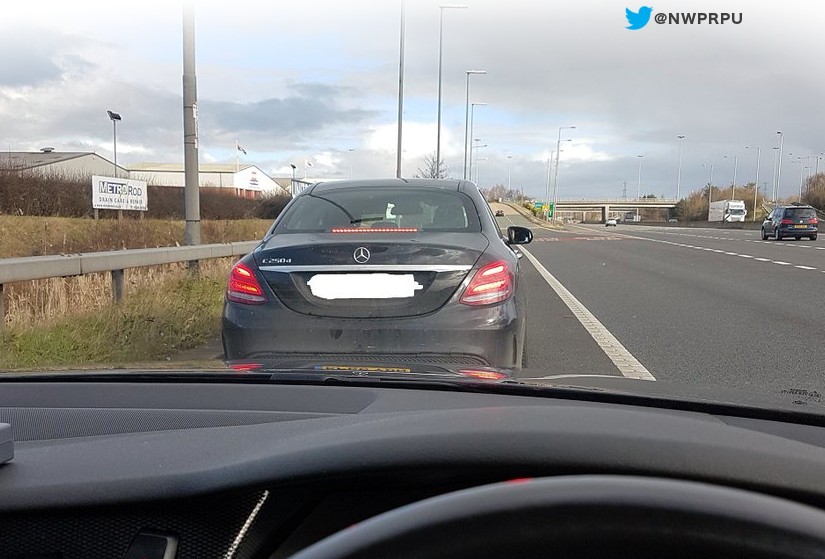 Driver caught on mobile phone in Deeside today one of the first to be issued ticket under new legislation