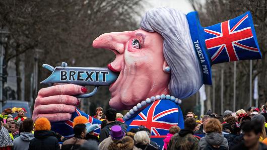 A float featuring British Premier Theresa May drives in the annual Rose Monday parade on Feb. 27 2017 in Dusseldorf Germany