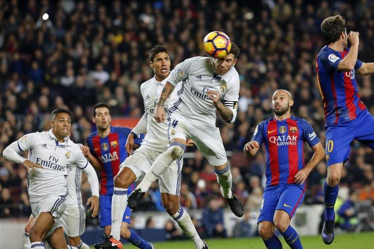 Real Madrid's defender Sergio Ramos heads a ball to score the equalizer