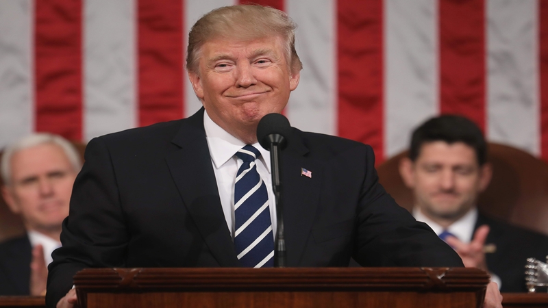 Vice President Mike Pence and Speaker of the House Paul Ryan listen as US President Donald J. Trump delivers his first address to a joint session of Congress from the floor of the House of Representatives in Washington DC USA 28 February 20