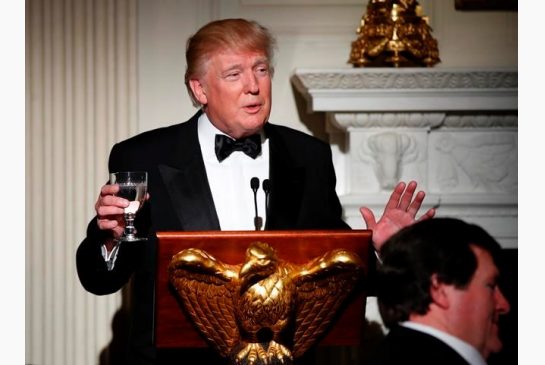 President Donald Trump makes a toast during a dinner reception for the annual National Governors Association winter meeting Sunday Feb. 26 2017 at the State Dining Room of the White House in Washington