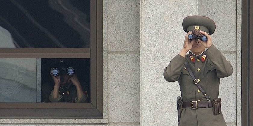 Soldiers from the Korean People's Army look south while on duty in the Joint Security Area U.S. Army official Korean Demilitarized Zone