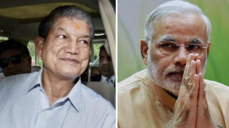 Uttarakhand Chief Minister Harish Rawat and Prime MInister Narendra Modi