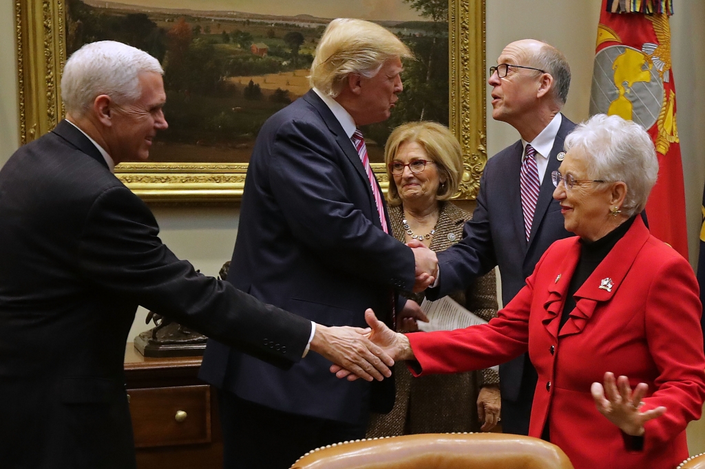 President Donald Trump greets Energy and Commerce Committee Chairman Greg Walden R-Ore., as Vice President Mike Pence greets Education and Workforce Committee Chairwoman Virginia Foxx R-N.C. before a meeting to discuss the American