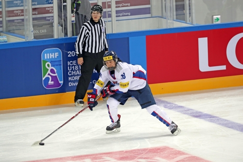 South Korean forward Danelle Im controls the puck against Slovenia at the International Ice Hockey Federation Women's World Championship Division II Group A at Kwandong Hockey Centre in Gangneung Gangwo