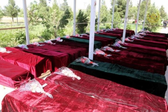 Coffins containing the bodies of Afghan national Army soldiers killed in April 21's attack on an army headquarters are lined up in Mazar-i-Sharif northern Afghanistan