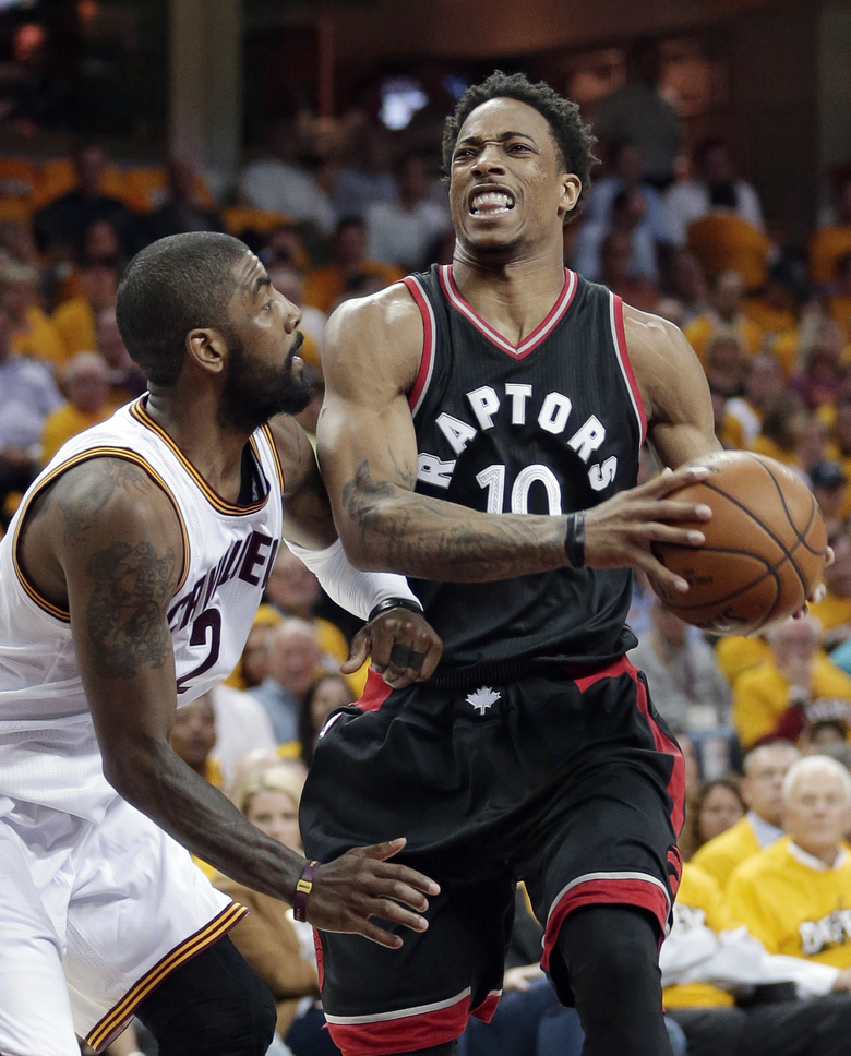 Toronto Raptors’ De Mar DeRozan drives against Cleveland Cavaliers’ Kyrie Irving in the first half in Game 1 of a second-round NBA basketball playoff series Monday