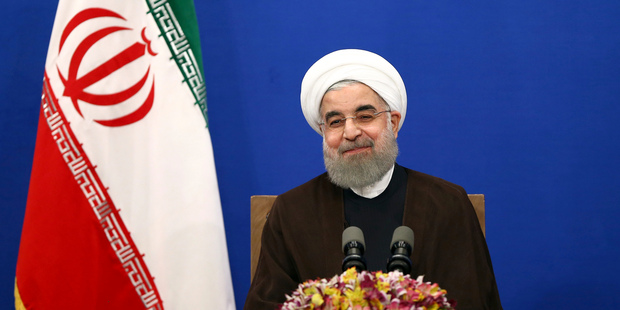 Iranian President Hassan Rouhani attends a televised speech after he won the election