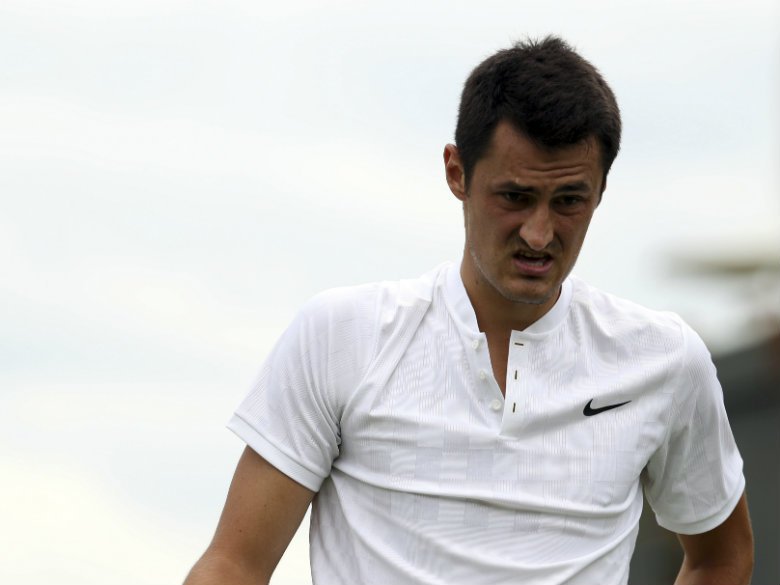 Tomic's Wimbledon words draw $15K fine racket sponsor loss