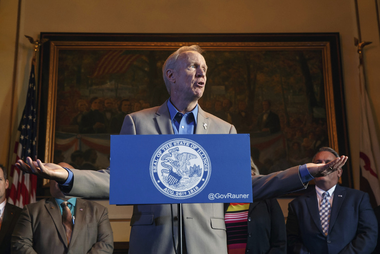 Illinois Gov. Bruce Rauner speaks during a news conference on the first day of a special session on education funding at the state Capitol in Springfield Ill. Rauner used his veto powers this week to rewrite