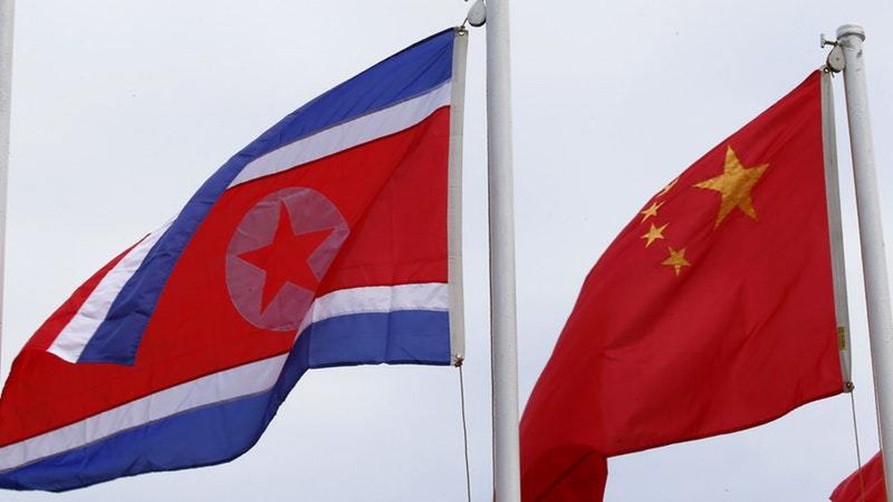 North Korean and Chinese flags