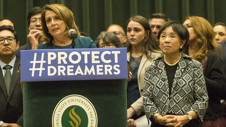 House Democratic Leader Nancy Pelosi left and Congresswoman Doris Matsui right deliver separate speeches urging Congress to pass the Dream Act during a news conference in the University Union Redwood Room Monday