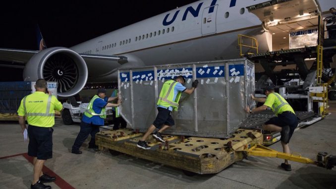 A United 777-300ER is loaded with relief supplies in Chicago