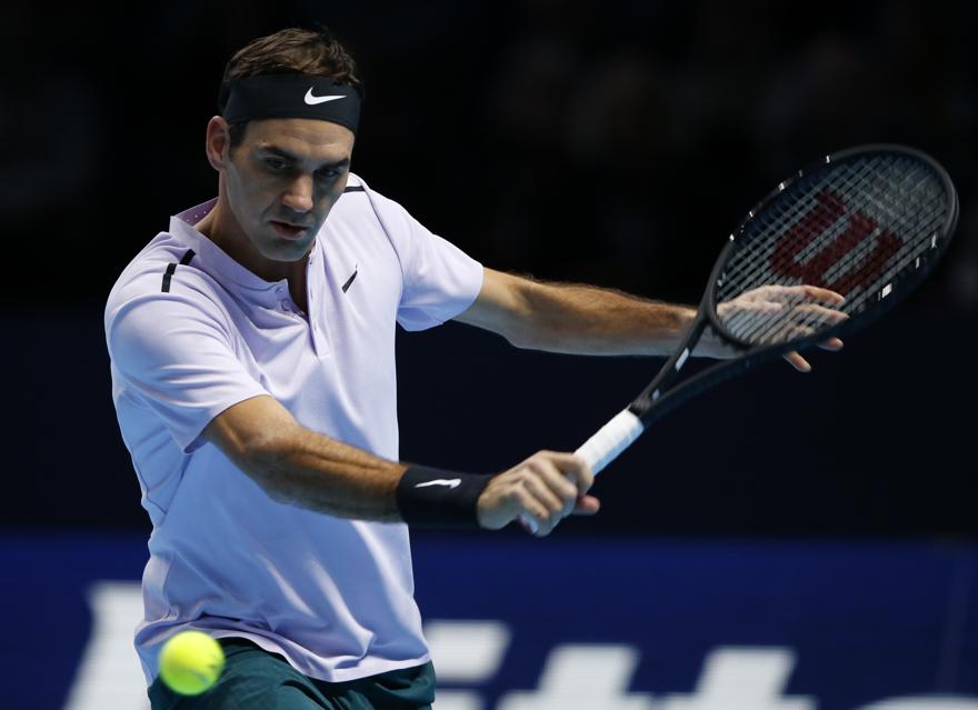 Roger Federer of Switzerland plays a return to Marin Cilic of Croatia during their mens singles match at the ATP World Finals at the O2 Arena in London Thursday Nov. 16 2017