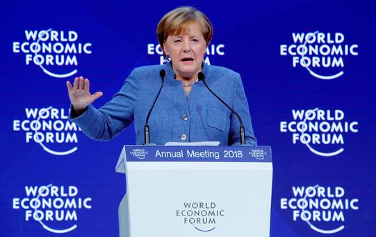 German Chancellor Angela Merkel gestures as she addresses a speech during the World Economic Forum annual meeting in Davos Switzerland