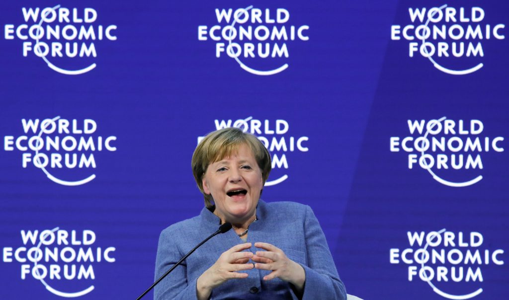 German Chancellor Angela Merkel laughs during the World Economic Forum annual meeting in Davos Switzerland