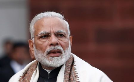 Narendra Modi speaks with the media inside the parliament premises on the first day of the budget session in New Delhi