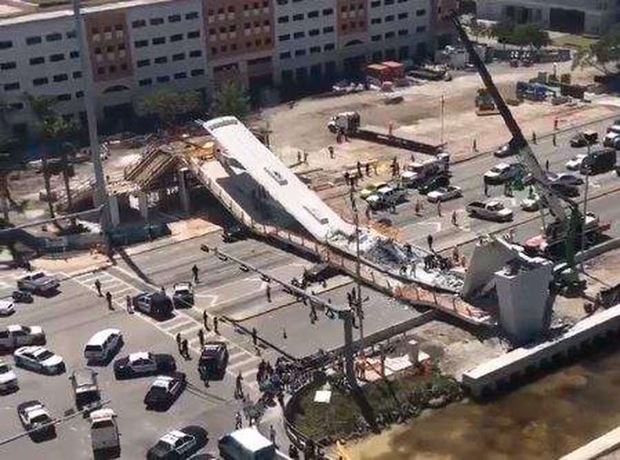 Pedestrian bridge at FIU collapses people trapped underneath. Police on scene. Miami Herald via Gabriela Collazo