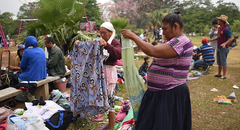 Central American migrants taking part in the Migrant Via Crucis caravan towards the United States pack their belongings as they prepare to leave a sport complex where they were camping in Matias Romero Oaxaca State Mexico