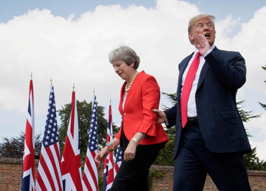 U.S. President Donald Trump walks with Britain's Prime Minister Theresa May prior to a joint press conference at Chequers near Aylesbury Britain