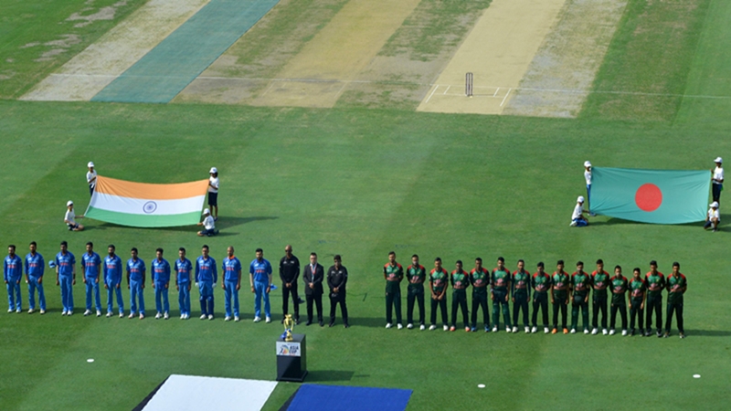Indian and Bangladesh players line up for the national anthems prior to the start of the Asia Cup cricket match