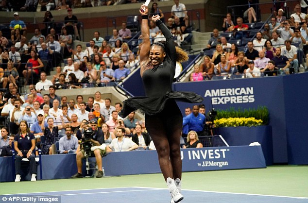 Serena Williams raises her arms in celebration after beating Karolina Pliskova 6-4 6-3