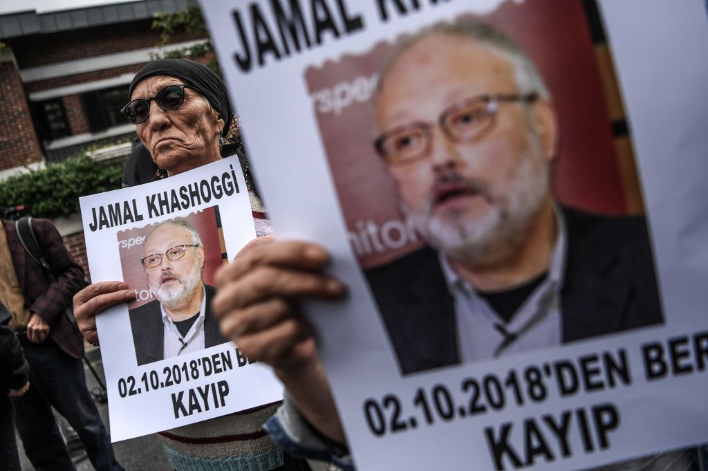 Protesters hold a portrait of missing journalist and Riyadh critic Jamal Khashoggi reading'Jamal Khashoggi is missing since October 2 during a demonstration in front of the Saudi Arabian consulate