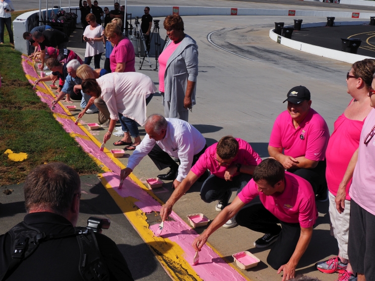 Jamie Mc Murray and Kasey Kahne Join Breast Cancer Survivors to Paint Martinsville’s Curbs Pink
