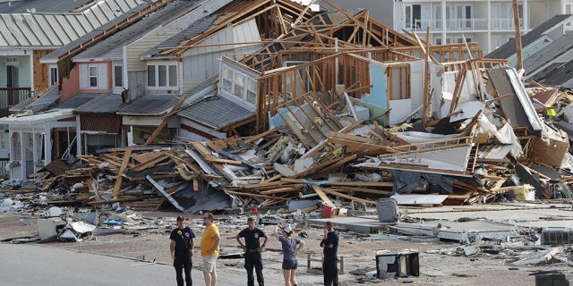 Rescue crews perform a search in the aftermath of Hurricane Michael in Mexico Beach Fla. Thursday