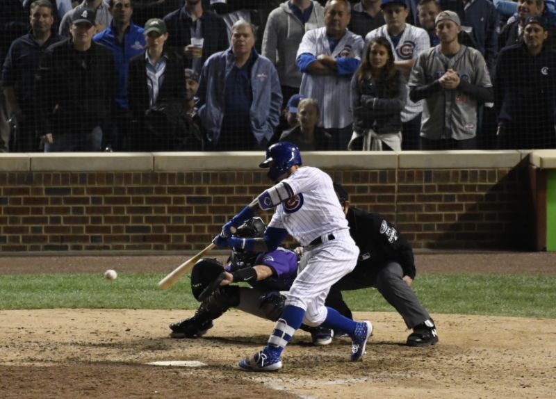 Chicago Cubs&#x27 Javier Baez hits a one-run double against the Colorado Rockies during the eighth inning of the National League wild-card playoff baseball game Tuesday OCT. 2 2018 in Chicago